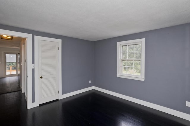 7 Summit Dr, Westfield, MA 01085 - unfurnished bedroom featuring dark wood-style flooring and a closet