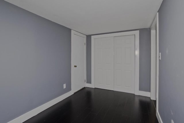 7 Summit Dr, Westfield, MA 01085 - unfurnished bedroom featuring dark wood-type flooring and a closet