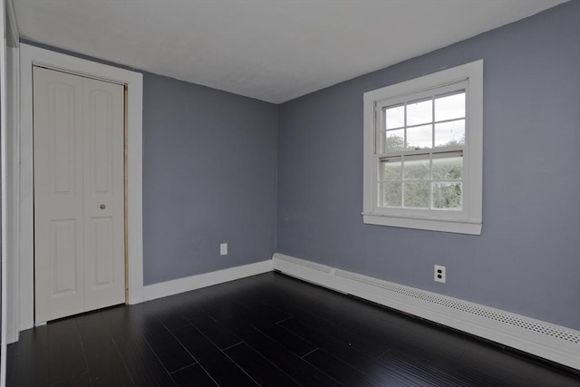 7 Summit Dr, Westfield, MA 01085 - spare room with baseboard heating and dark wood finished floors