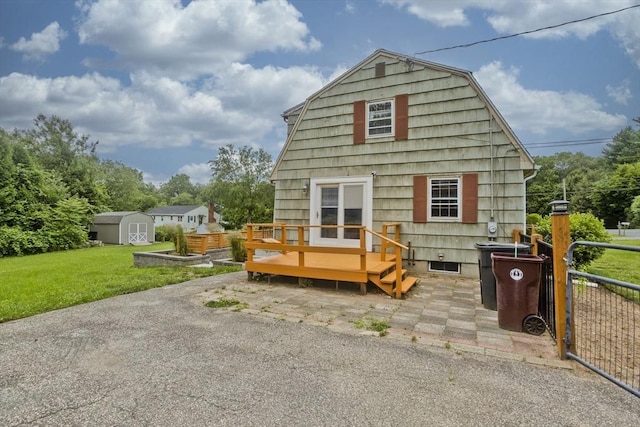 7 Summit Dr, Westfield, MA 01085 - rear view of house featuring a shed, a deck, a gambrel roof, and a patio