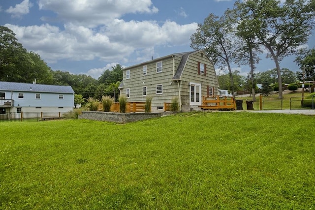7 Summit Dr, Westfield, MA 01085 - back of property with a gambrel roof and a wooden deck