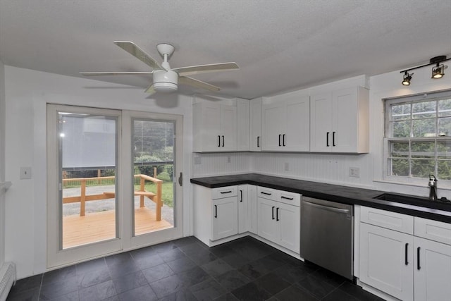7 Summit Dr, Westfield, MA 01085 - kitchen with dishwasher, dark countertops, ceiling fan, white cabinets, and a textured ceiling