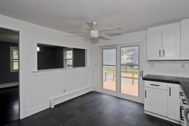 7 Summit Dr, Westfield, MA 01085 - unfurnished dining area featuring baseboard heating, plenty of natural light, and a ceiling fan