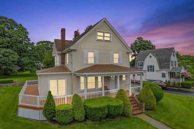 2 Howard St, Braintree, MA 02184 - view of front of home with a chimney, covered porch, a lawn, and roof with shingles
