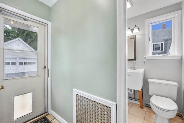 2 Howard St, Braintree, MA 02184 - bathroom featuring tile patterned floors, vanity, and radiator