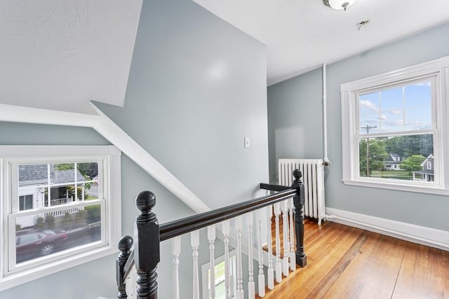 2 Howard St, Braintree, MA 02184 - corridor featuring radiator, an upstairs landing, and hardwood / wood-style flooring