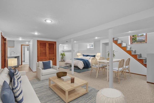 2 Howard St, Braintree, MA 02184 - living room with recessed lighting, light carpet, and stairway