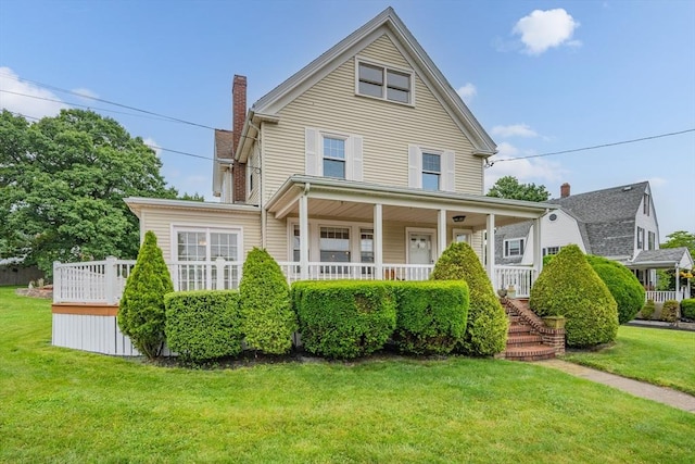 2 Howard St, Braintree, MA 02184 - view of front of property with a chimney, a front lawn, and a porch