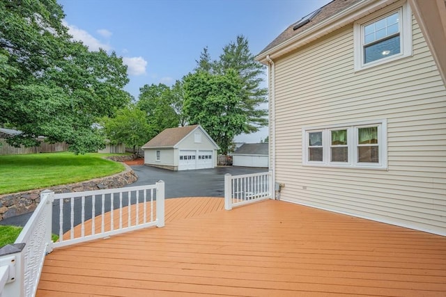 2 Howard St, Braintree, MA 02184 - wooden deck with an outdoor structure, a lawn, and a garage