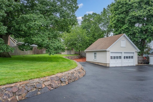 2 Howard St, Braintree, MA 02184 - view of property exterior with an outbuilding, a garage, and roof with shingles
