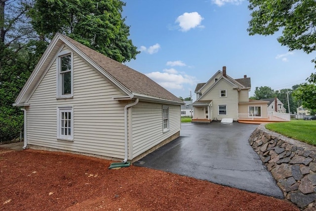 2 Howard St, Braintree, MA 02184 - view of side of home featuring a wooden deck