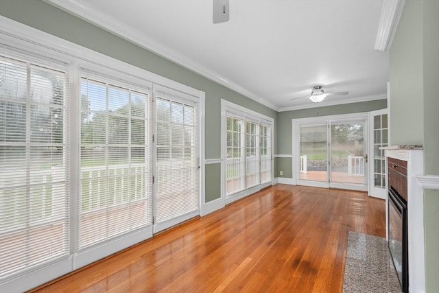 2 Howard St, Braintree, MA 02184 - unfurnished sunroom with wood-type flooring and ornamental molding