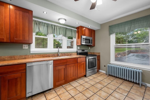 2 Howard St, Braintree, MA 02184 - kitchen featuring stainless steel appliances, radiator, plenty of natural light, a ceiling fan, and recessed lighting