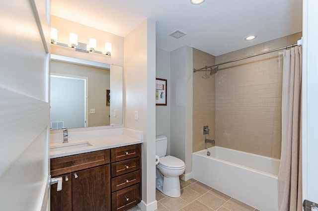 full bathroom with tile patterned flooring, shower / bath combo, vanity, and toilet