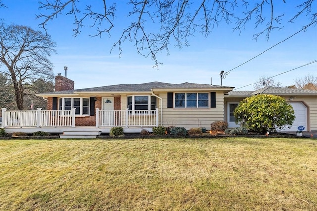 single story home featuring a garage and a front lawn