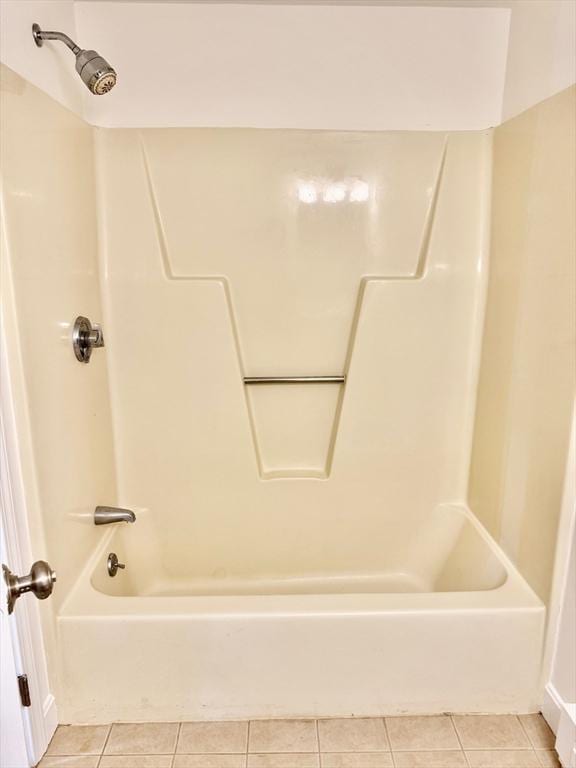 full bathroom featuring shower / bath combination and tile patterned flooring