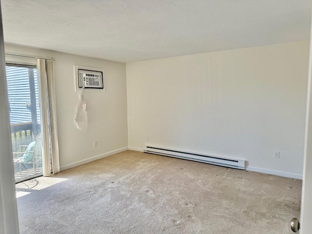 carpeted spare room with a baseboard heating unit, a wall mounted air conditioner, and baseboards