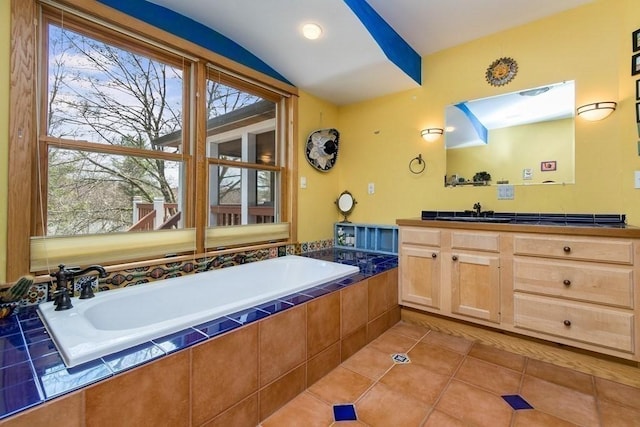 18 W Shore Dr, Goshen, MA 01032 - bathroom with tile patterned floors, a garden tub, vaulted ceiling, and vanity