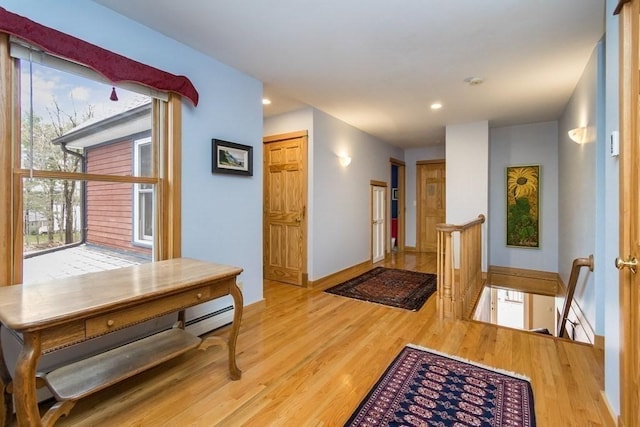 18 W Shore Dr, Goshen, MA 01032 - entrance foyer featuring wood finished floors, baseboards, recessed lighting, and a baseboard radiator