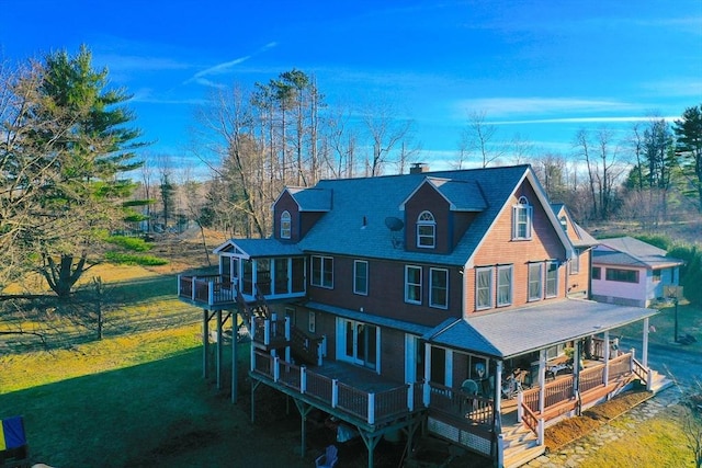 18 W Shore Dr, Goshen, MA 01032 - back of house with a lawn, a porch, and a shingled roof