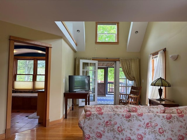 18 W Shore Dr, Goshen, MA 01032 - living area featuring wood finished floors, baseboards, and a skylight