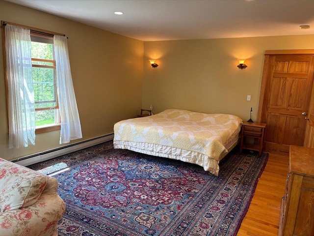 18 W Shore Dr, Goshen, MA 01032 - bedroom featuring baseboard heating, light wood finished floors, and recessed lighting