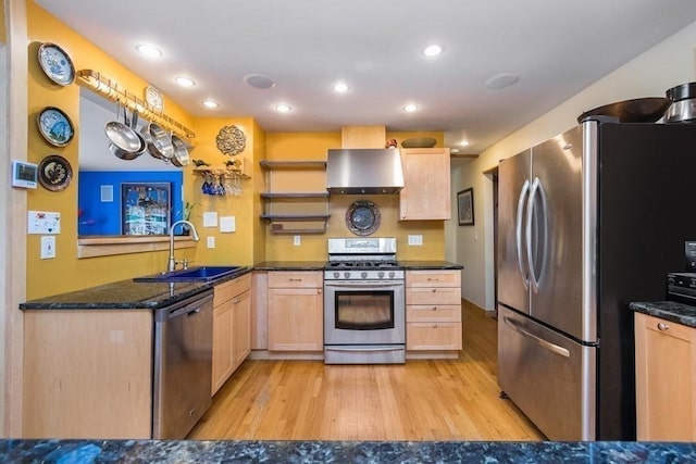 18 W Shore Dr, Goshen, MA 01032 - kitchen featuring stainless steel appliances, a sink, exhaust hood, light wood finished floors, and light brown cabinetry