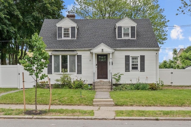 10 Jefferson St, Lawrence, MA 01843 - cape cod-style house featuring a gate, a chimney, and roof with shingles