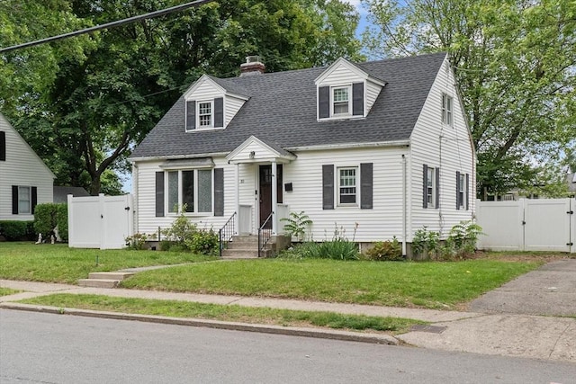 10 Jefferson St, Lawrence, MA 01843 - cape cod house featuring a gate, roof with shingles, a chimney, and entry steps