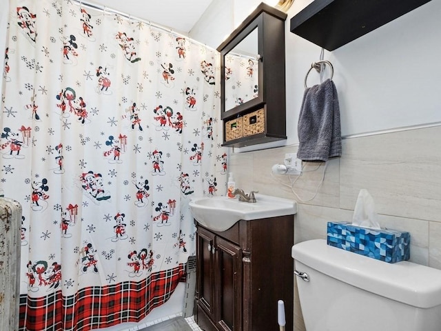 bathroom with a shower with shower curtain, toilet, tile walls, and vanity