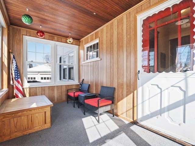 sunroom / solarium featuring wood ceiling