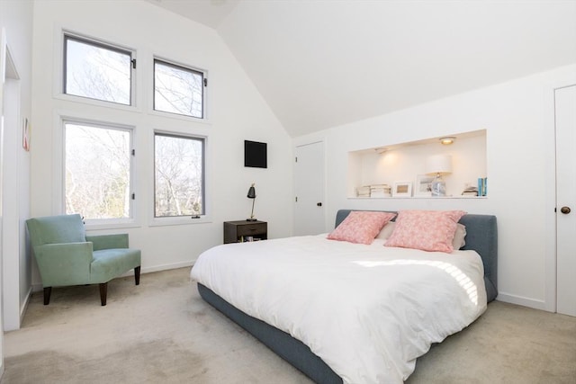 bedroom featuring high vaulted ceiling, carpet flooring, and baseboards