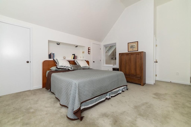 bedroom with baseboards, high vaulted ceiling, and light carpet