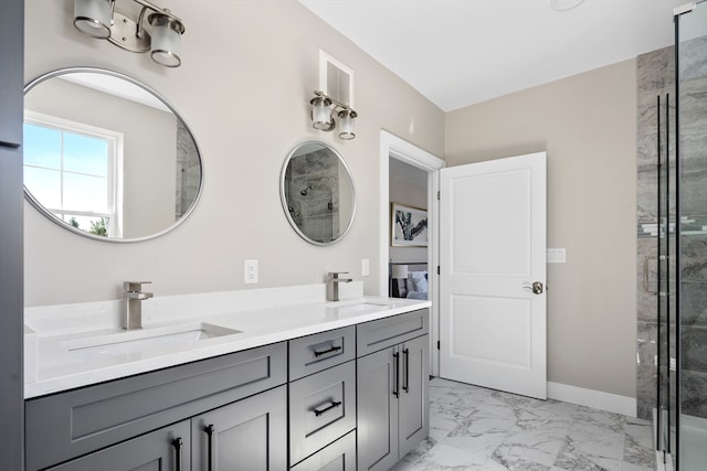 bathroom with an enclosed shower and vanity