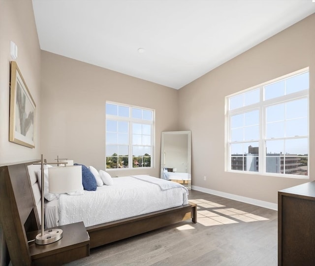 bedroom with light wood-type flooring