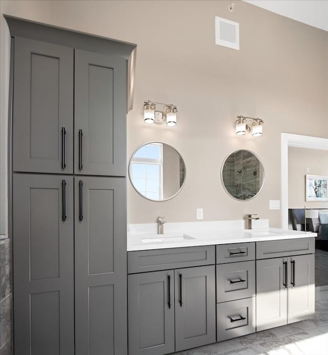 bathroom with lofted ceiling and vanity