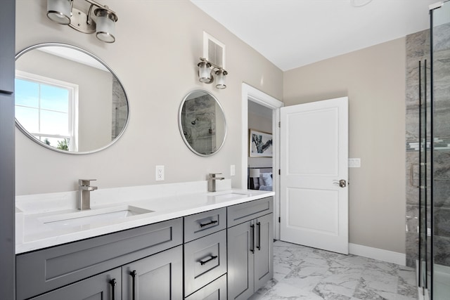 bathroom featuring vanity and a shower with shower door