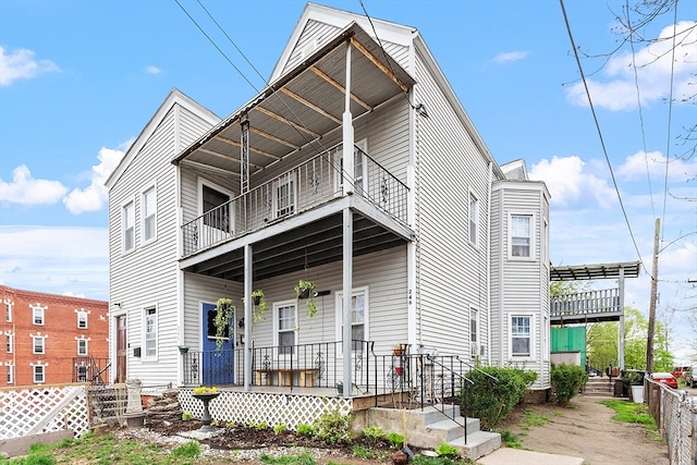 view of front of property with a balcony