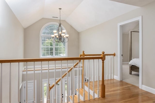 3 Integrity Way, Groton, MA 01450 - hall featuring a chandelier, wood finished floors, an upstairs landing, and vaulted ceiling