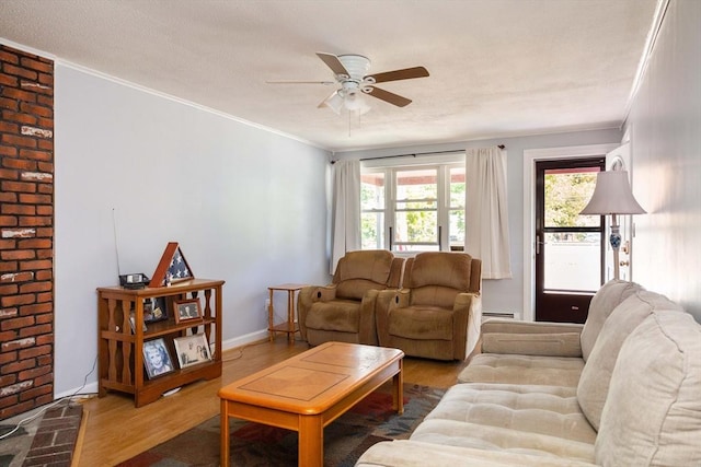 69 Front St, Shirley, MA 01464 - living area featuring a ceiling fan, ornamental molding, and wood finished floors