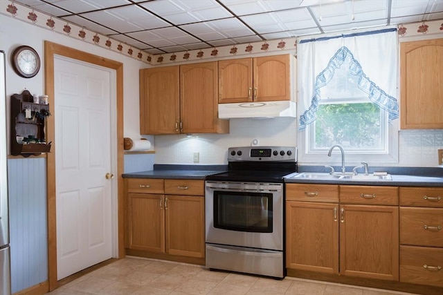 69 Front St, Shirley, MA 01464 - kitchen featuring stainless steel electric range, under cabinet range hood, a sink, and backsplash