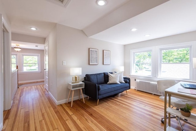 1690 Centre St Unit 2, Boston, MA 02132 - living area featuring radiator heating unit, baseboards, light wood-style floors, and recessed lighting