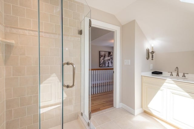 1690 Centre St Unit 2, Boston, MA 02132 - bathroom with a shower stall, tile patterned flooring, vanity, and lofted ceiling