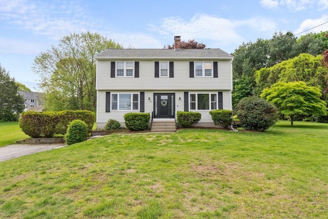 26 Dodge Rd, Sutton, MA 01590 - colonial house with a front yard and a chimney