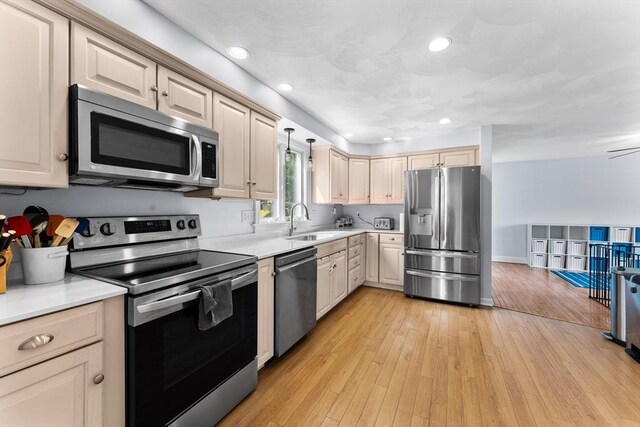 26 Dodge Rd, Sutton, MA 01590 - kitchen featuring stainless steel appliances, a sink, light countertops, light wood-type flooring, and recessed lighting
