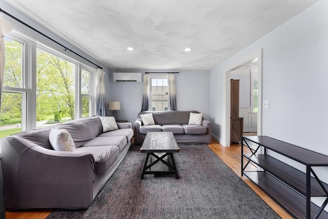 26 Dodge Rd, Sutton, MA 01590 - living area featuring a wall mounted air conditioner, recessed lighting, and wood finished floors