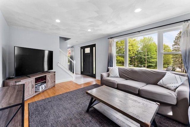 26 Dodge Rd, Sutton, MA 01590 - living room with stairway, wood finished floors, baseboards, and recessed lighting