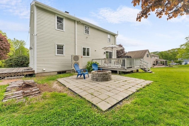 26 Dodge Rd, Sutton, MA 01590 - rear view of property with a patio, a fire pit, a deck, and a lawn