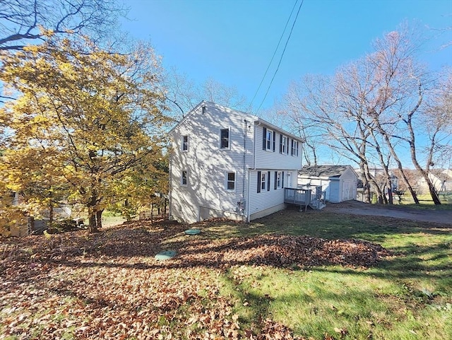 view of property exterior with a yard