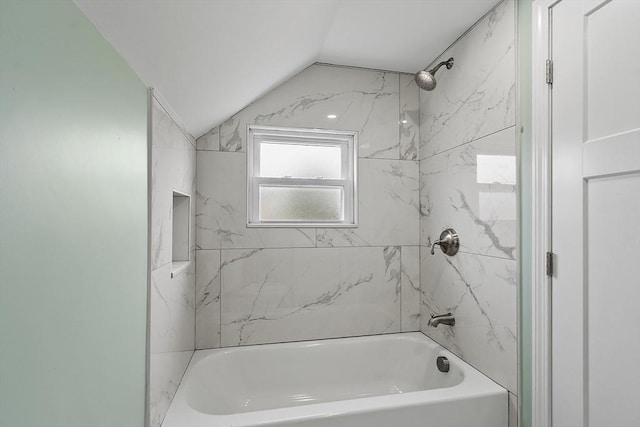 full bath with vaulted ceiling and bathing tub / shower combination